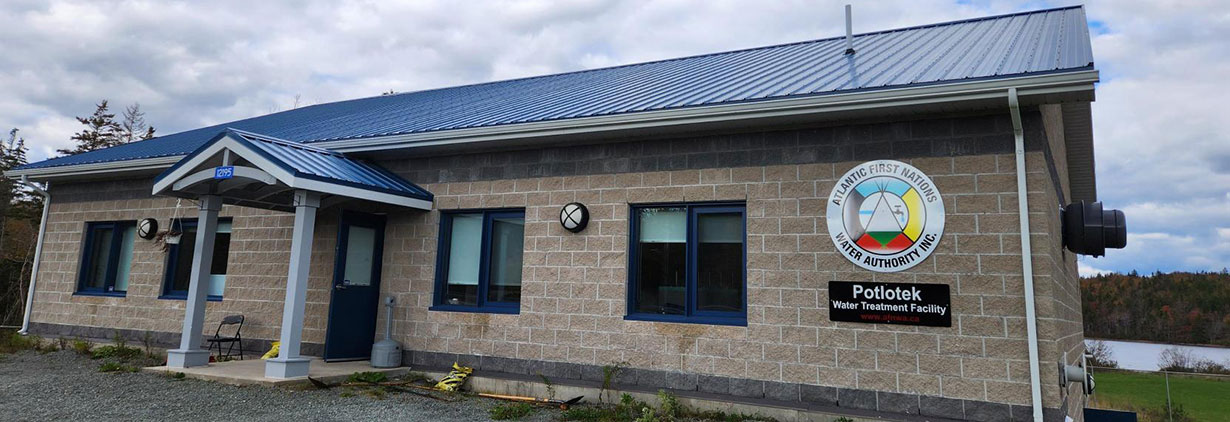 AFNWA water treatment facility featuring the AFNWA logo. Below the logo, a sign reads Potlotek Water Treatment Facility.